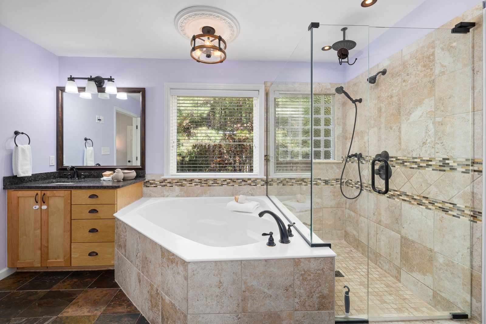 Frameless corner shower enclosure installed by Makibaki in a Vernon Hills, IL bathroom