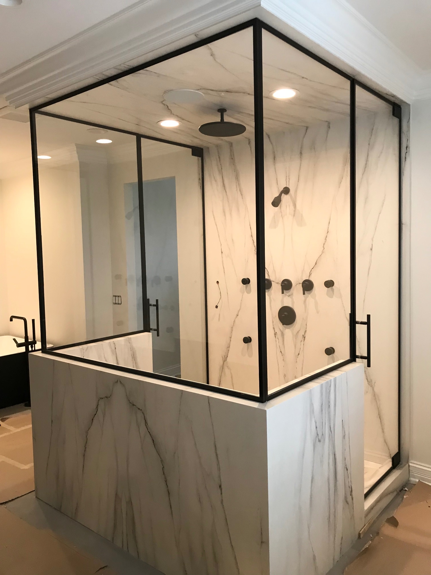 Custom shower enclosure installed by Makibaki in a Bannockburn, IL primary bath