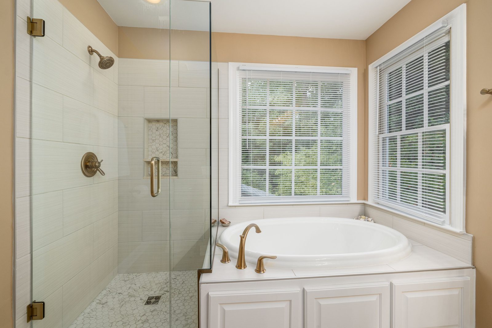 Glass tub door with brass hardware